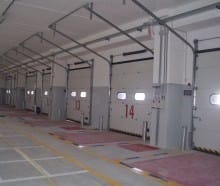 Porte sezionali industriali automatiche a sistema di scorrimento silenzioso